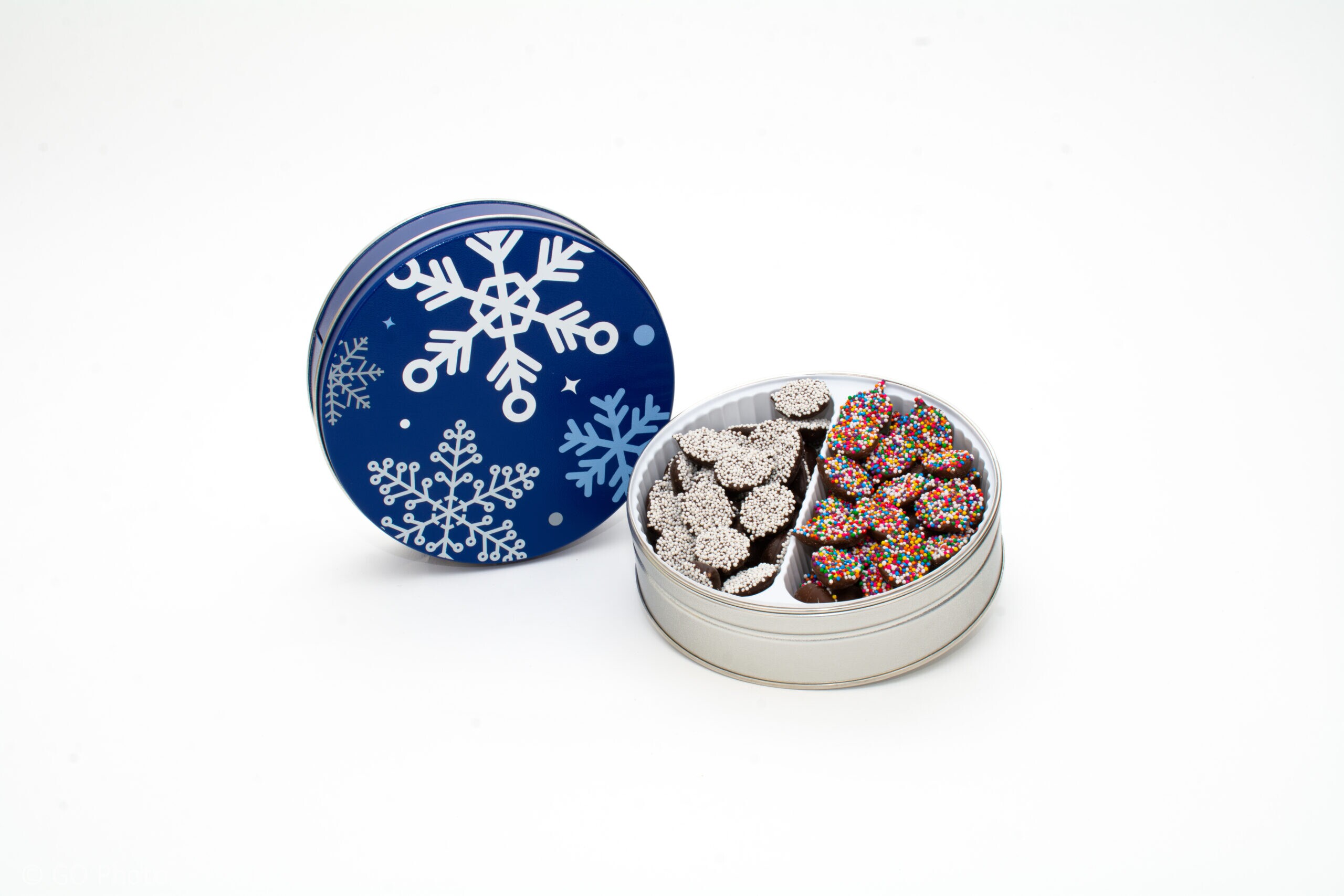 Asher's blue Christmas tins filled with Christmas nonpareils.