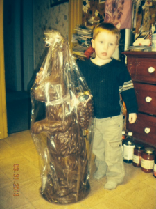 boy shows off his chocolate Easter bunny