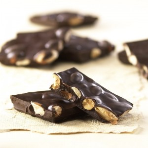 dark chocolate almond bark broken into pieces to show the perfect proportion of chocolate with nuts