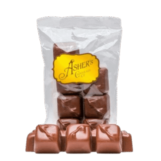 Clear bag of square Peanut Butter Smoothie, 4 oz. bag milk chocolate candies with a gold Ashers Chocolate Co. label.