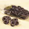 Mini Dark three (3) ring Pretzels in clear Cello Bag with four (4) mini pretzels outside of bag to reveal color, size, shape, and texture.