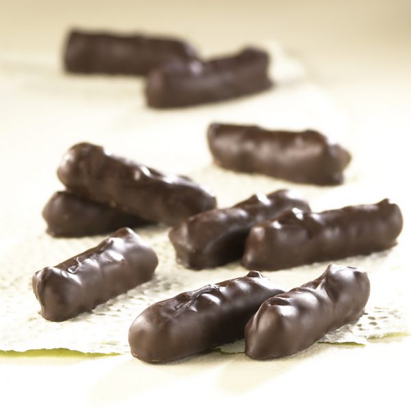 Dark Chocolate Pretzel Bites scattered on white background revealing candies shape, size, and chocolate texture.