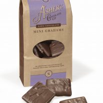 Asher's Mini Grahams Dark Chocolate Coffee Bag. Three (3) grahams are shown to size and texture outside of the closed coffee bag. The coffee bag is brown with light purple artwork.