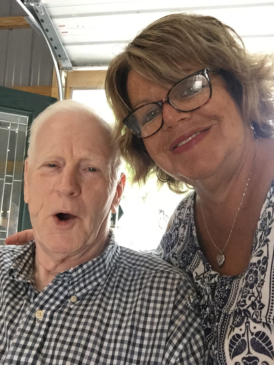 Val Edmonton, employee highlight, smiles with an attendee of the Centre County Grange Fair