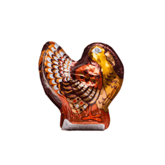 A 1oz. Hollow Dark Chocolate Turkey, foil-wrapped and decorated with colorful feathers, stands upright against a plain white background.