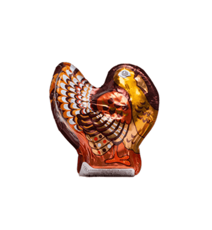 A 1oz. Hollow Dark Chocolate Turkey, foil-wrapped and decorated with colorful feathers, stands upright against a plain white background.