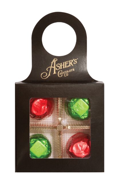 A black Ashers Chocolate Co. gift box with a handle, featuring a clear window displaying four foil-wrapped chocolates—two in red and two in green wrappers.