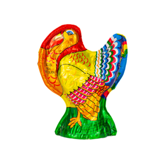 A foil-wrapped milk chocolate shaped like a colorful rooster, with vibrant red, yellow, blue, and green patterns on its body and wings.