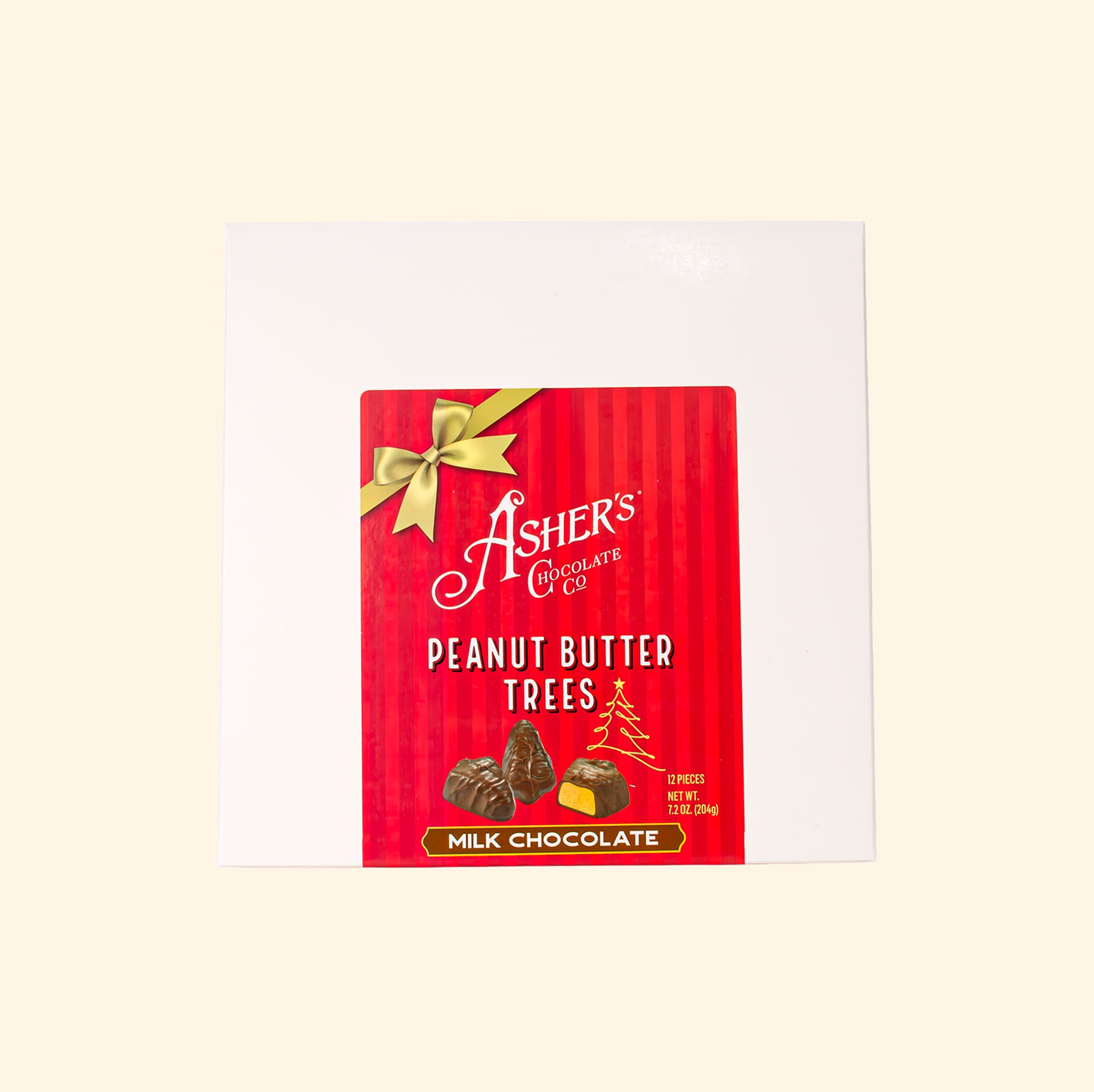 Box of Ashers Chocolate Co. milk chocolate peanut butter trees featuring a red label with a gold bow and an illustration of the chocolates.